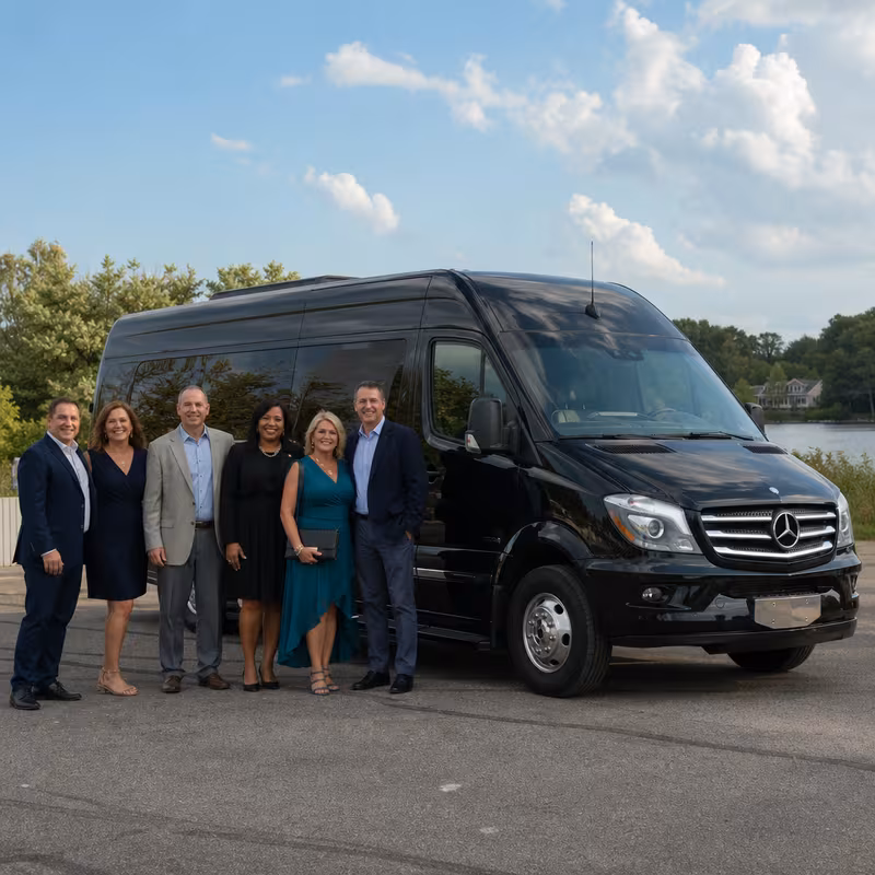 Group beside a Mercedes Sprinter limo from the Indianapolis fleet