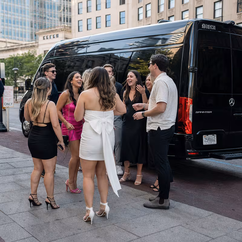 Group boarding a white charter bus for Bachelor & Bachelorette Transportation transportation in Indianapolis