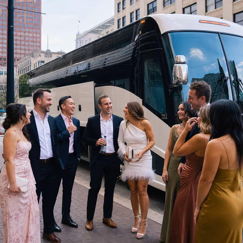 Passengers loading luggage while boarding an Indianapolis group shuttle