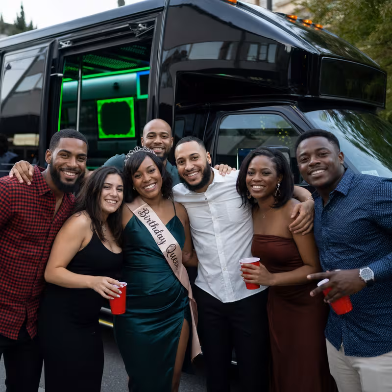Party bus interior with wraparound leather seating and LED lighting in Indianapolis