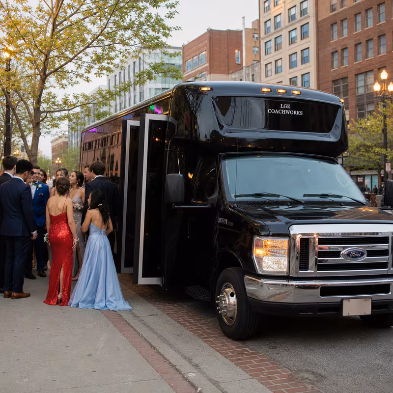 Passengers loading luggage while boarding an Indianapolis group shuttle