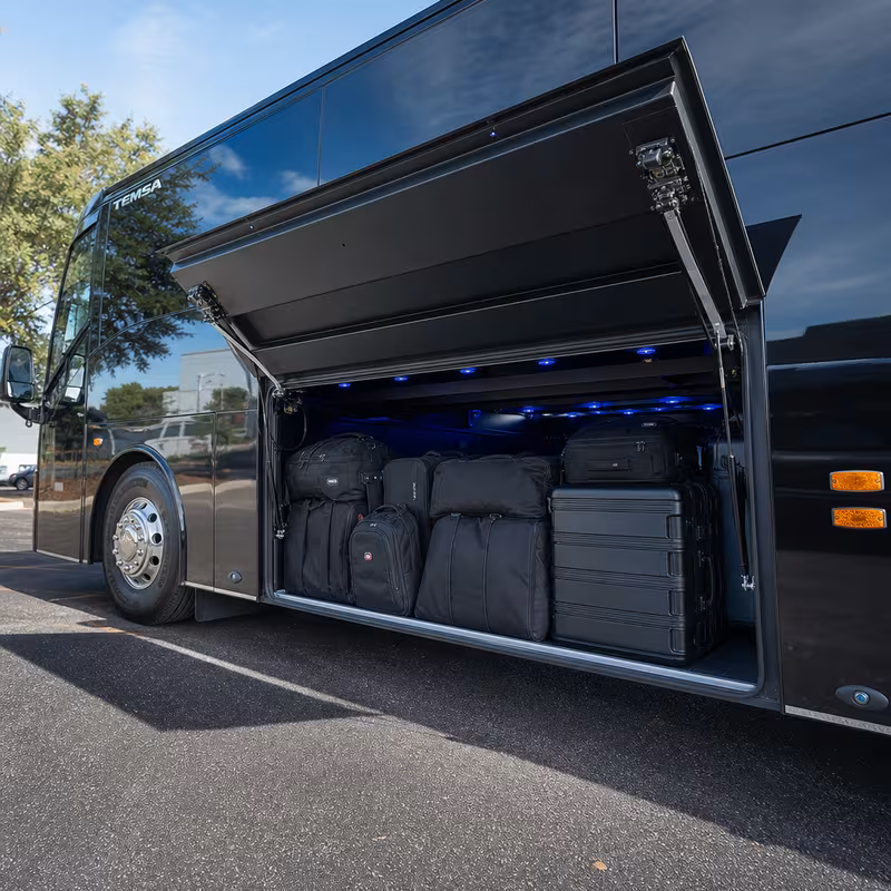 Party bus interior with wraparound leather seating and LED lighting in Indianapolis