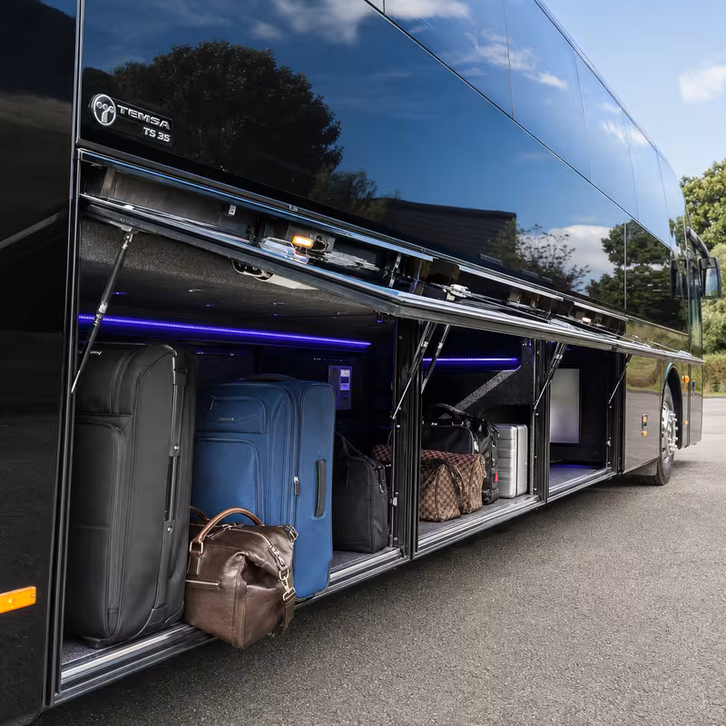 Party bus interior with wraparound leather seating and LED lighting in Indianapolis