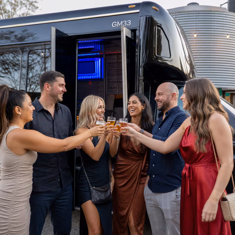 Passengers loading luggage while boarding an Indianapolis group shuttle